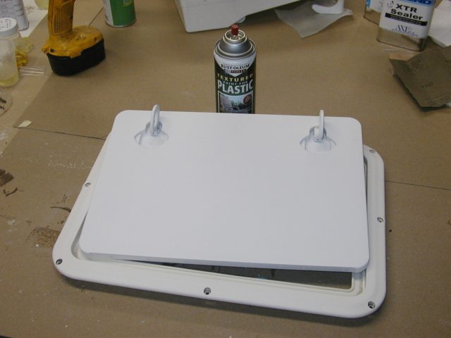 7. Paint the hatch with plastic compatible Rustoleum™ Textured Paint for Plastic. Krylon™ Fusion for Plastic™ also works well. In the end the hatch looks as good as new.
