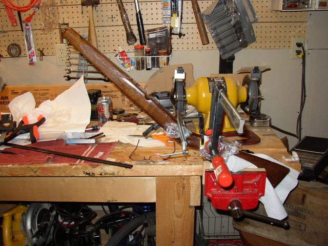 5. I used plastic wrap to keep the clamps from adhering to the walnut gunstock.