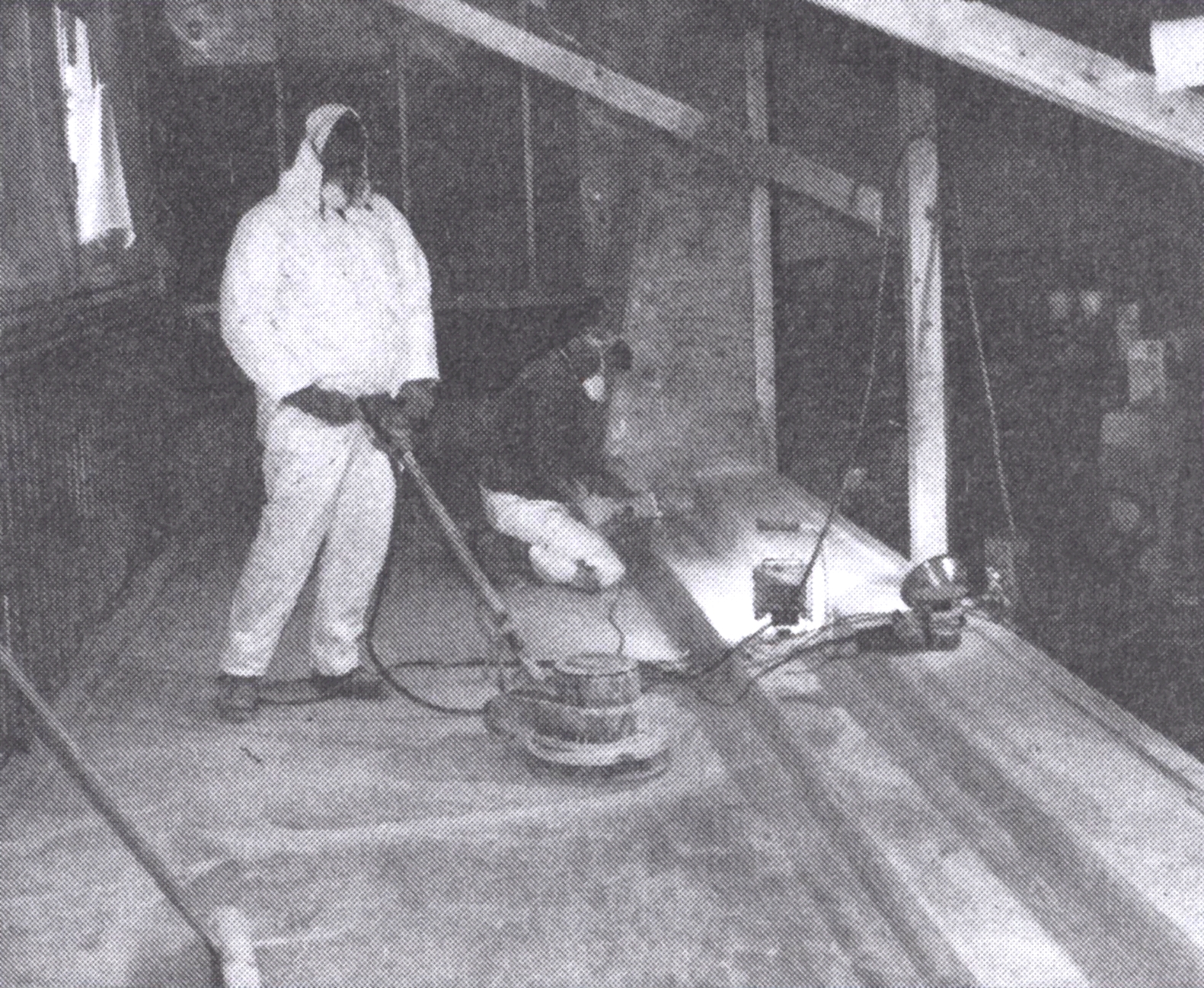 A coat of epoxy with a fire retardant additive was applied and the surfaces were sanded again. A floor sander was used on the large flat areas.