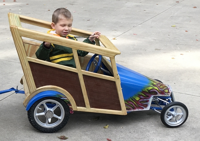 Car body is made with pine and mahogany veneer. The hood and fenders are painted sheet metal.