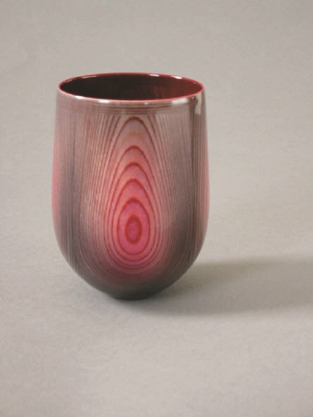 Elegant turned wood vessel in red