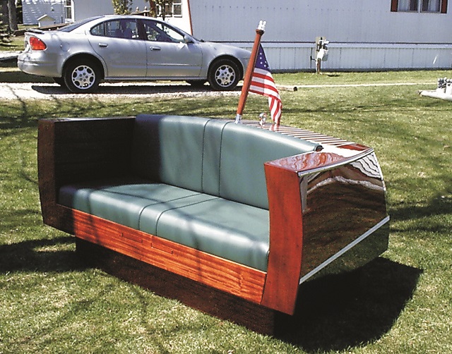 Mahogany couch with wooden runabout styling