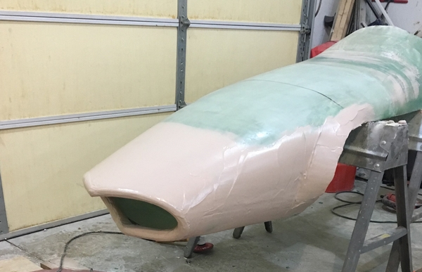 The fiberglass strips have been covered with 105/206/410 and are ready to be faired.