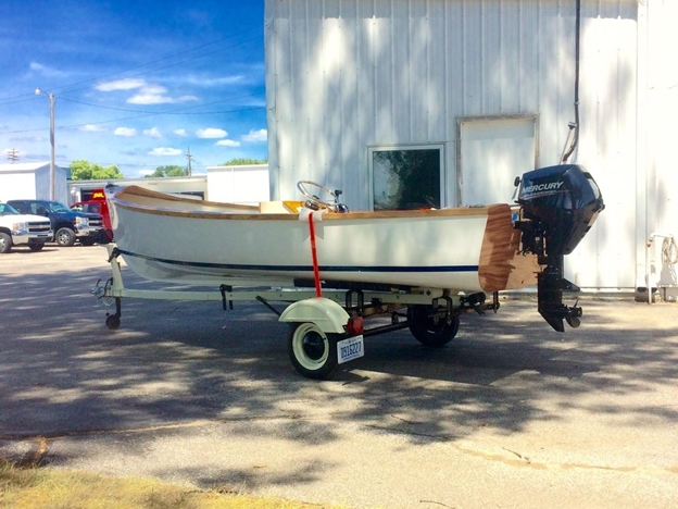 The completed Jericho Skiff. The donated trailer needed attention. It was completely disassembled, cleaned, primed and painted then reassembled with new bolts, lights, and tires. Its vintage styling goes well with the boat.