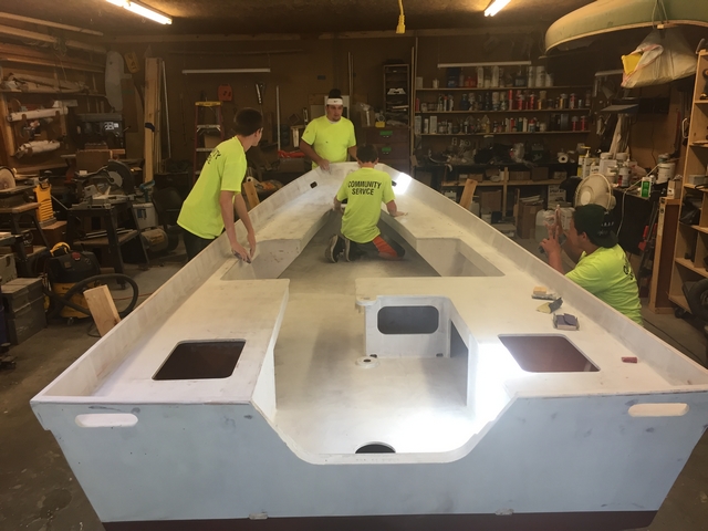 Primer being sanded before final coating.