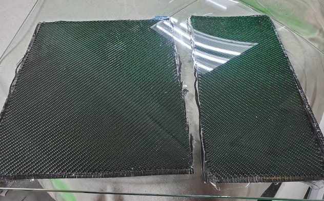 Two of the panels for the switches and gauges. The finished surface was carbon with green metallic accents woven through the fabric.
