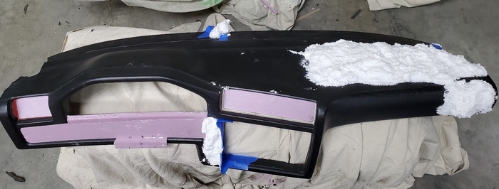 Ahead of carbon skinning, pink foam insulation board was used to fill in large flat areas.