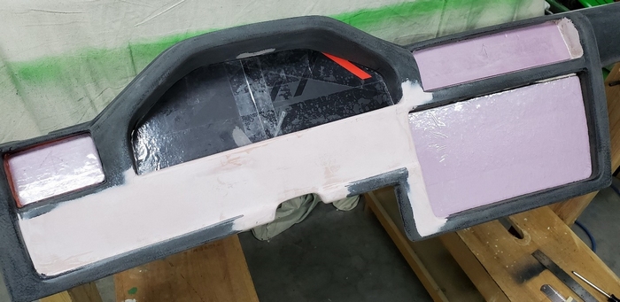 Foam or cardboard backing blocks were inserted into each opening to mold a flange for remounting hardware.