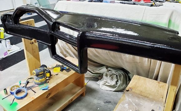 A black pigmented coat of G/flex was applied to the dash before applying the carbon fiber fabric.