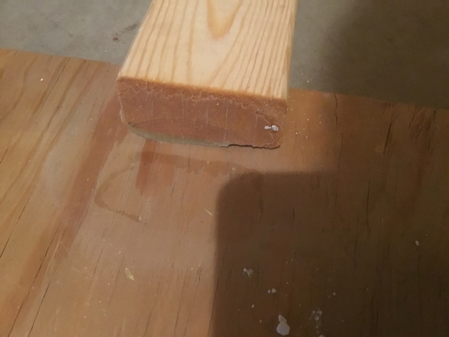This timber bonded unsuccessfully. You can see the shine of the epoxy on the bottom of the 2x4. Note that there are no wood fibers missing from the plywood panel in the top image or attached to the end grain in the bottom image.