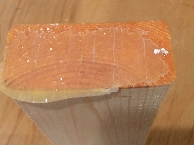 This timber bonded unsuccessfully. You can see the shine of the epoxy on the bottom of the 2x4. Note that there are no wood fibers missing from the plywood panel in the top image or attached to the end grain in the bottom image.