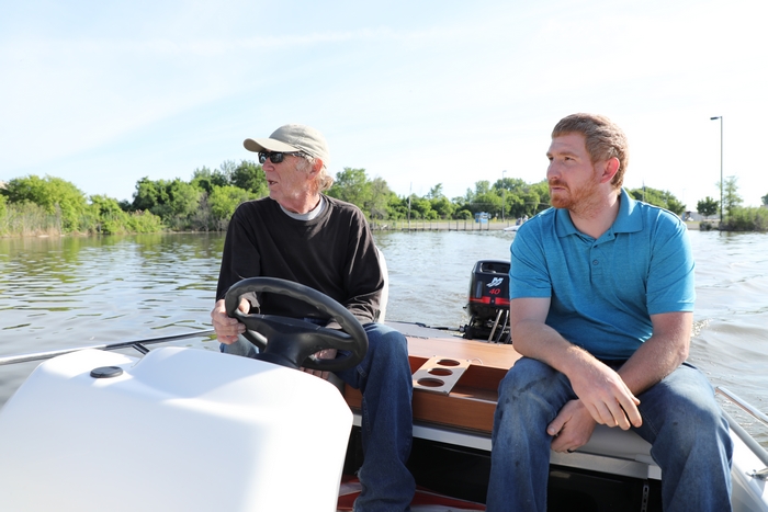 Jon Staudacher and Don Gutzmer watching the hydroplane THE ANIMAL on the Saginaw River.