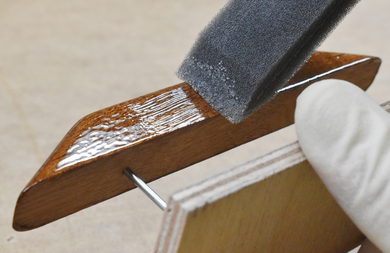 Tipping epoxy with a foam brush.