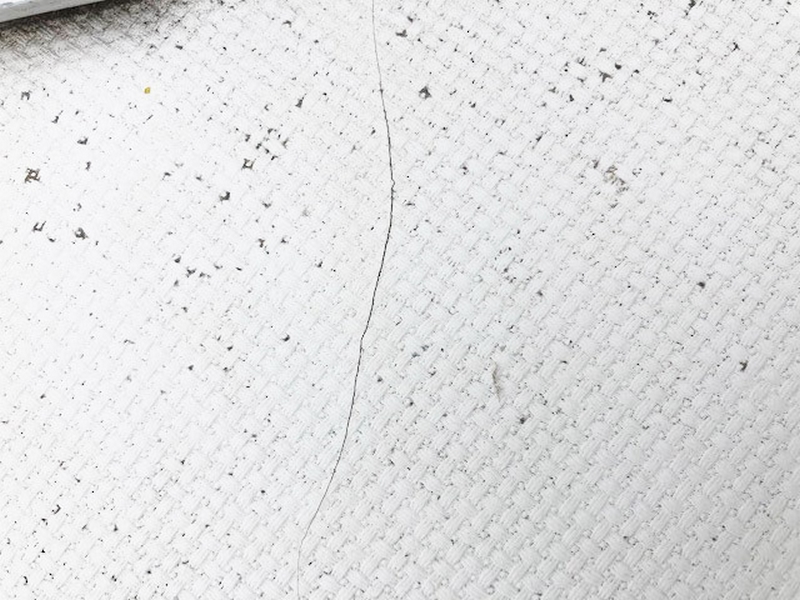 Minor single-line gelcoat cracks.