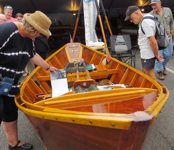 Wooden Boat Festival goers admiring the craftsmanship.