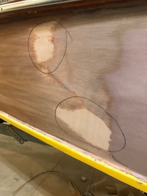 "After fairing the hull, there were still low areas to be filled with thickened epoxy." From the article, "Veneering a Wooden Aristo Craft" by Don Gutzmer, featured in Epoxyworks 61.