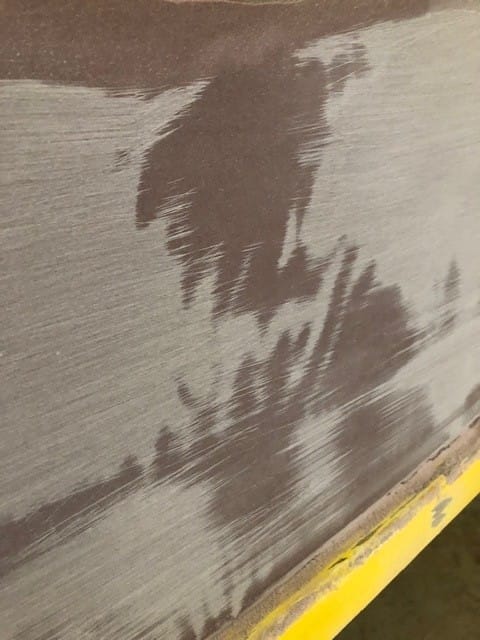 "Areas not hit by the sanding block remained dark and shiny." From the article, "Veneering a Wooden Aristo Craft" by Don Gutzmer, featured in Epoxyworks 61.
