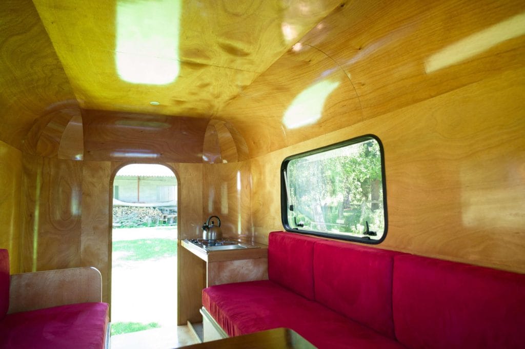 "The interior with the seat backs drop between the bunks to make a large double 2m x 1.6m (2'6" x 5'3")." From the article, "The Woodenwidget Plystream Camper" by Robin 'Benjy' Benjamin, featured in Epoxyworks 61.